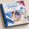 Custom hardcover family travel photo book featuring a Santorini, Greece holiday cover.