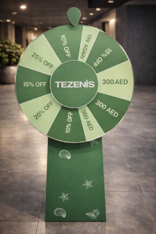Custom green spin the wheel display with Tezenis branding, featuring discount offers and prize segments, used for retail promotions and in-store customer engagement.