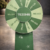 Custom green spin the wheel display with Tezenis branding, featuring discount offers and prize segments, used for retail promotions and in-store customer engagement.