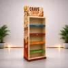 Left-angle view of a freestanding custom POS display unit with printed side graphics, branded header and colour-coded shelves.