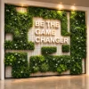 Front view of a custom artificial grass wall backdrop with floral greenery and 3D branded text.