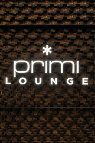 Aluminium frontlit 3D letter signage in Dubai for Primi Lounge on decorative wooden feature wall