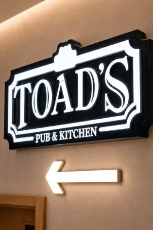 Push through LED signage box in Dubai with acrylic light pass-through letters for restaurant directional signage