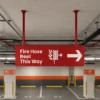 Double-sided hanging wayfinding signage in Dubai for parking area fire hose reel direction sign