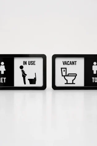 Acrylic bathroom occupancy sign displaying In Use and Vacant sliding indicator options
