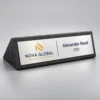 Black wooden finish acrylic desk name plate with a silver plate featuring a UV-printed name, designation and company logo