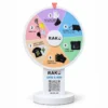 RAKU branded prize wheel with six pastel sections, a white stand and a circular base